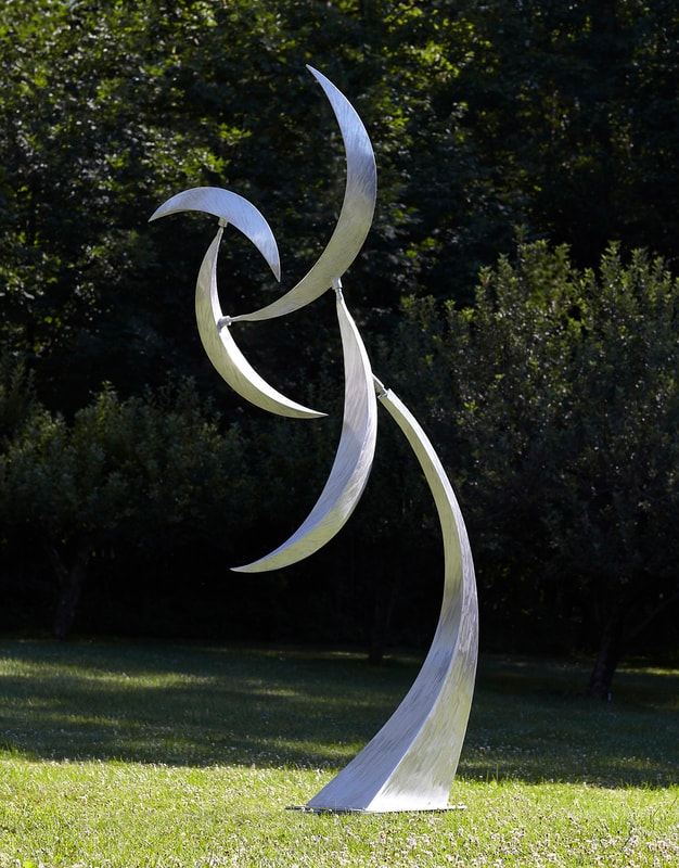 Jeff Kahn Kinetic Sculpture. Large scale outdoor sculpture created from aluminum and stainless steel and powered by wind.